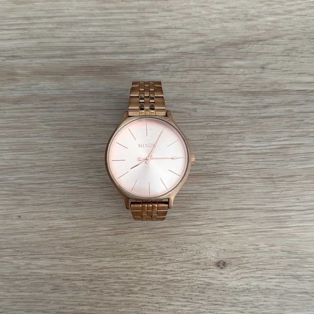 Nixon Pink and Gold Timepiece